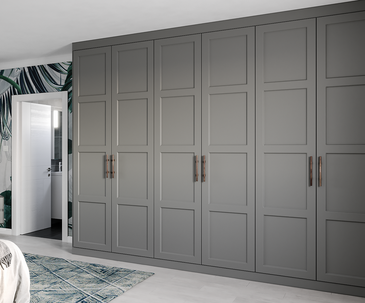 Modern bedroom with gray wardrobe, bed, and leaf-patterned wallpaper.