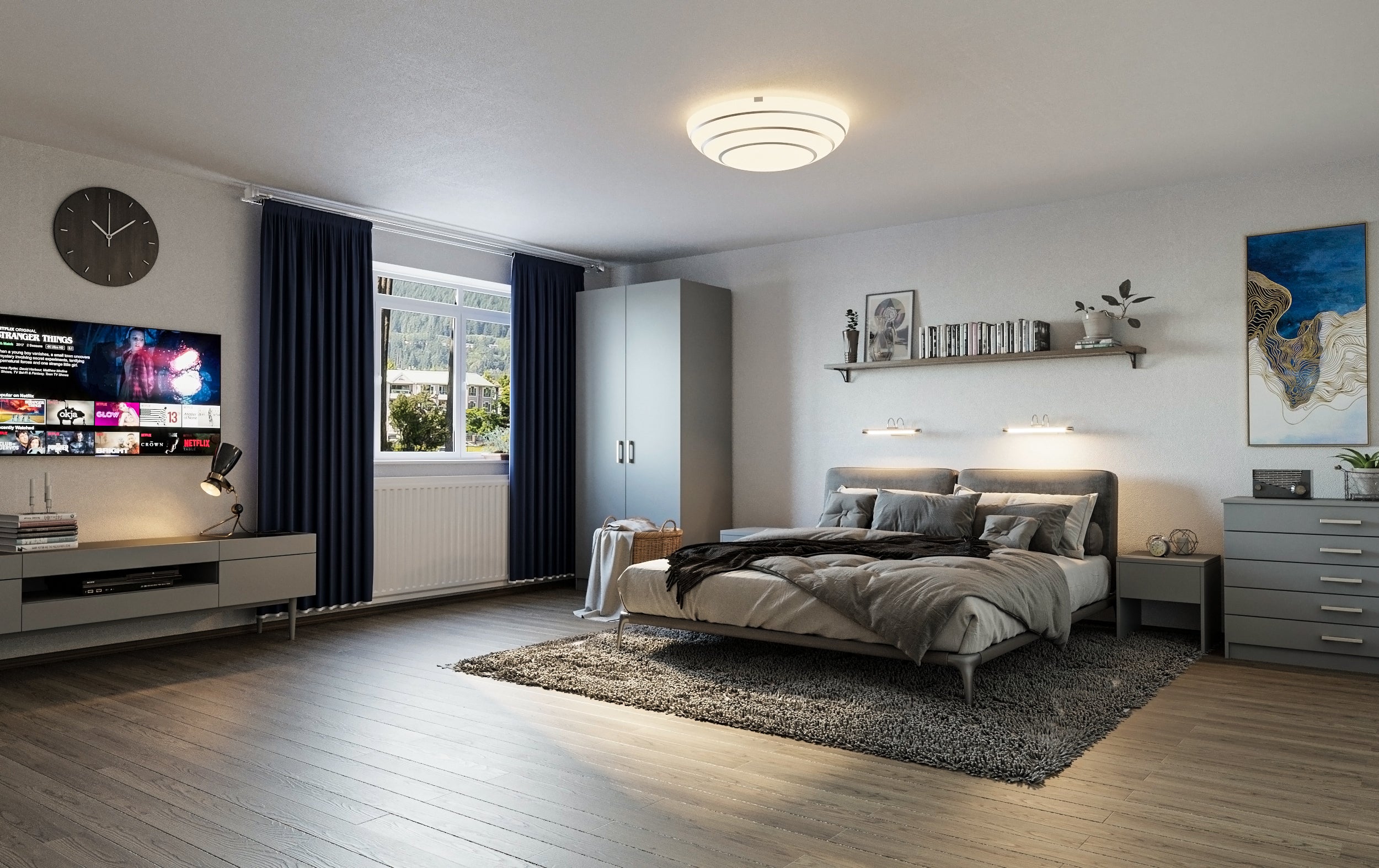 Modern bedroom with a bed, TV, and decor elements.
