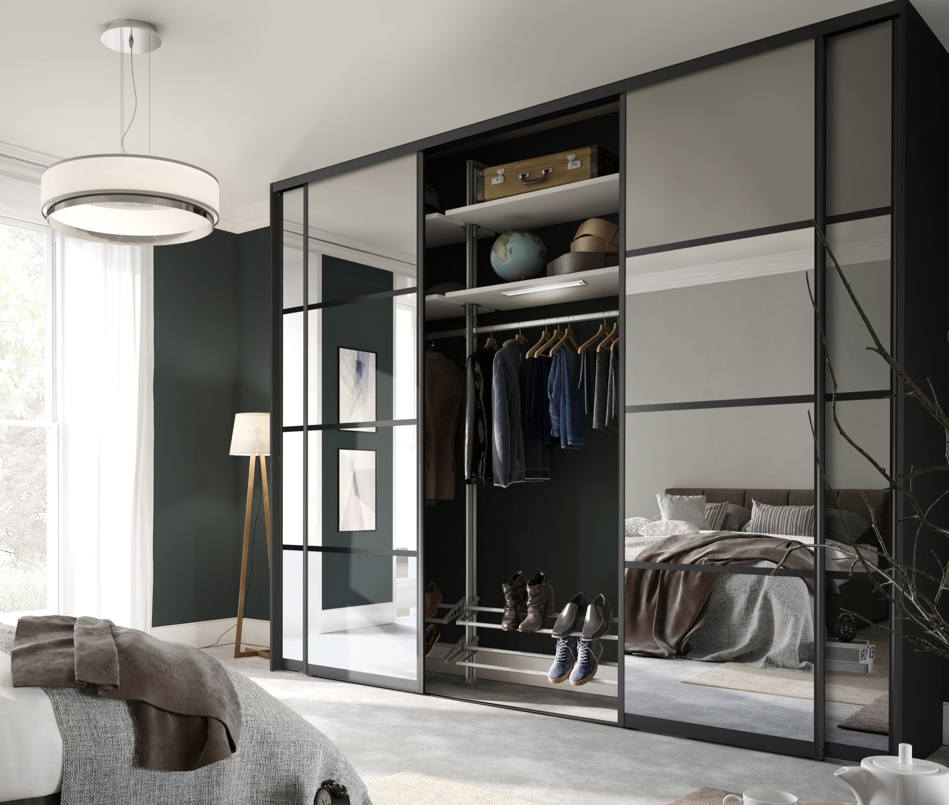 Modern bedroom with a large mirrored wardrobe and bed.