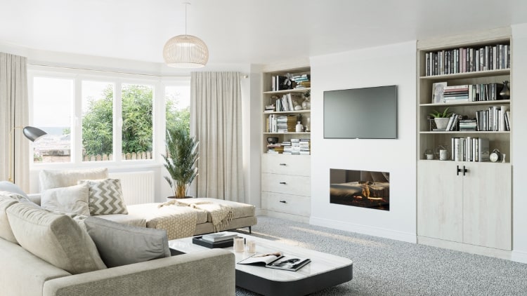 Two white pine fitted bookcases in living room