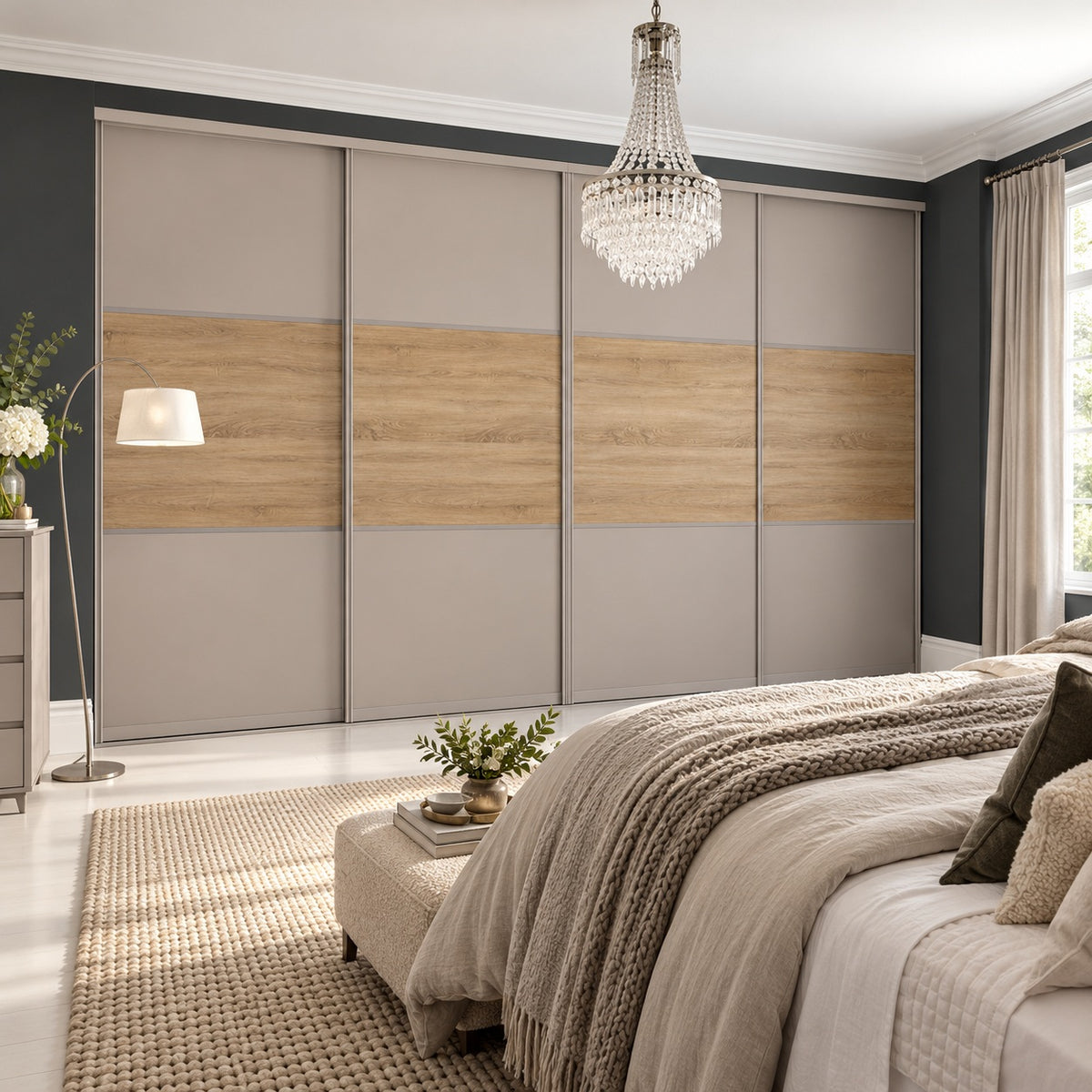 Luxury bedroom with four cashmere and oak three-panel sliding wardrobe doors