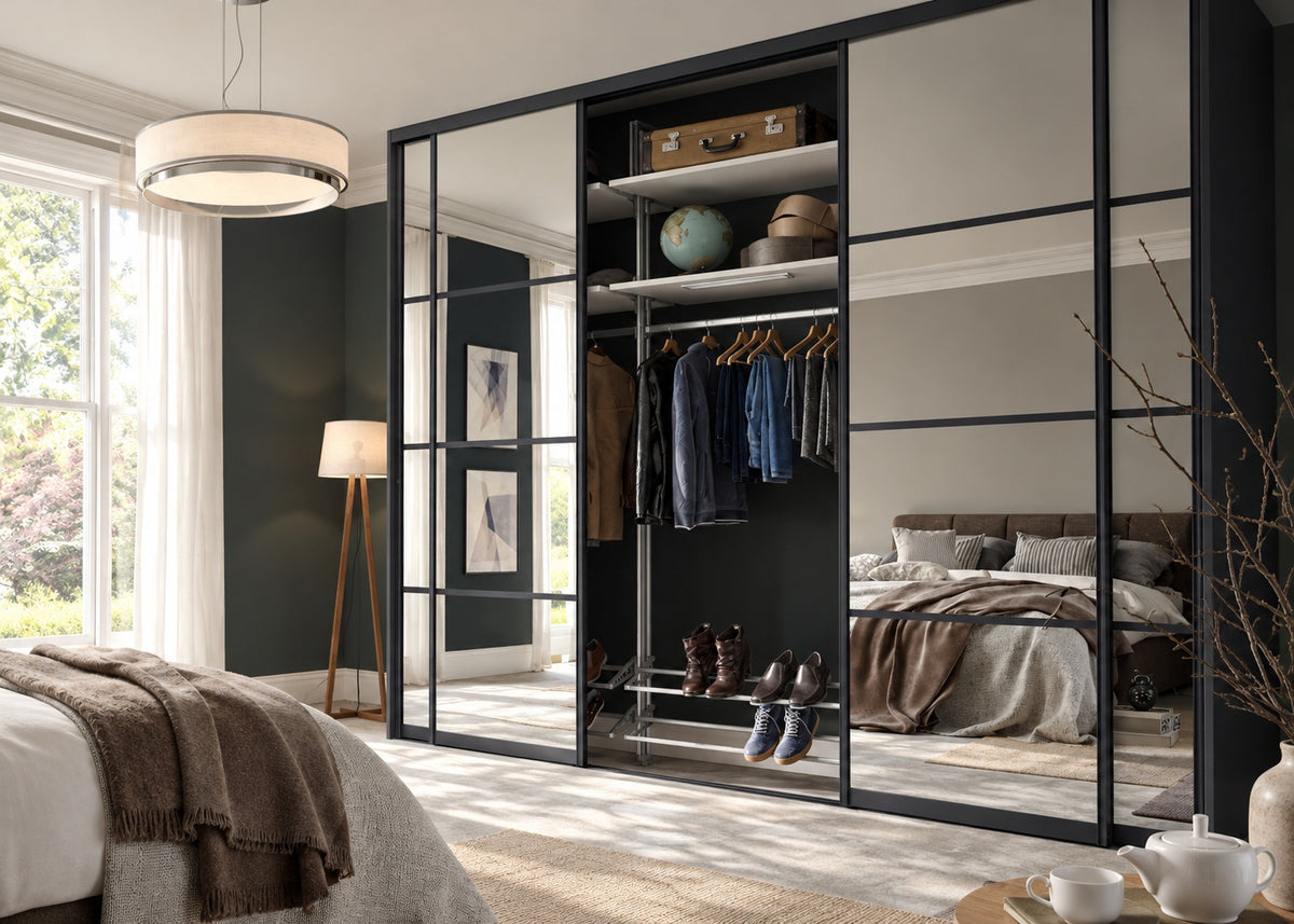 Luxury mirrored sliding wardrobe with visible hanging storage and shoe racks
