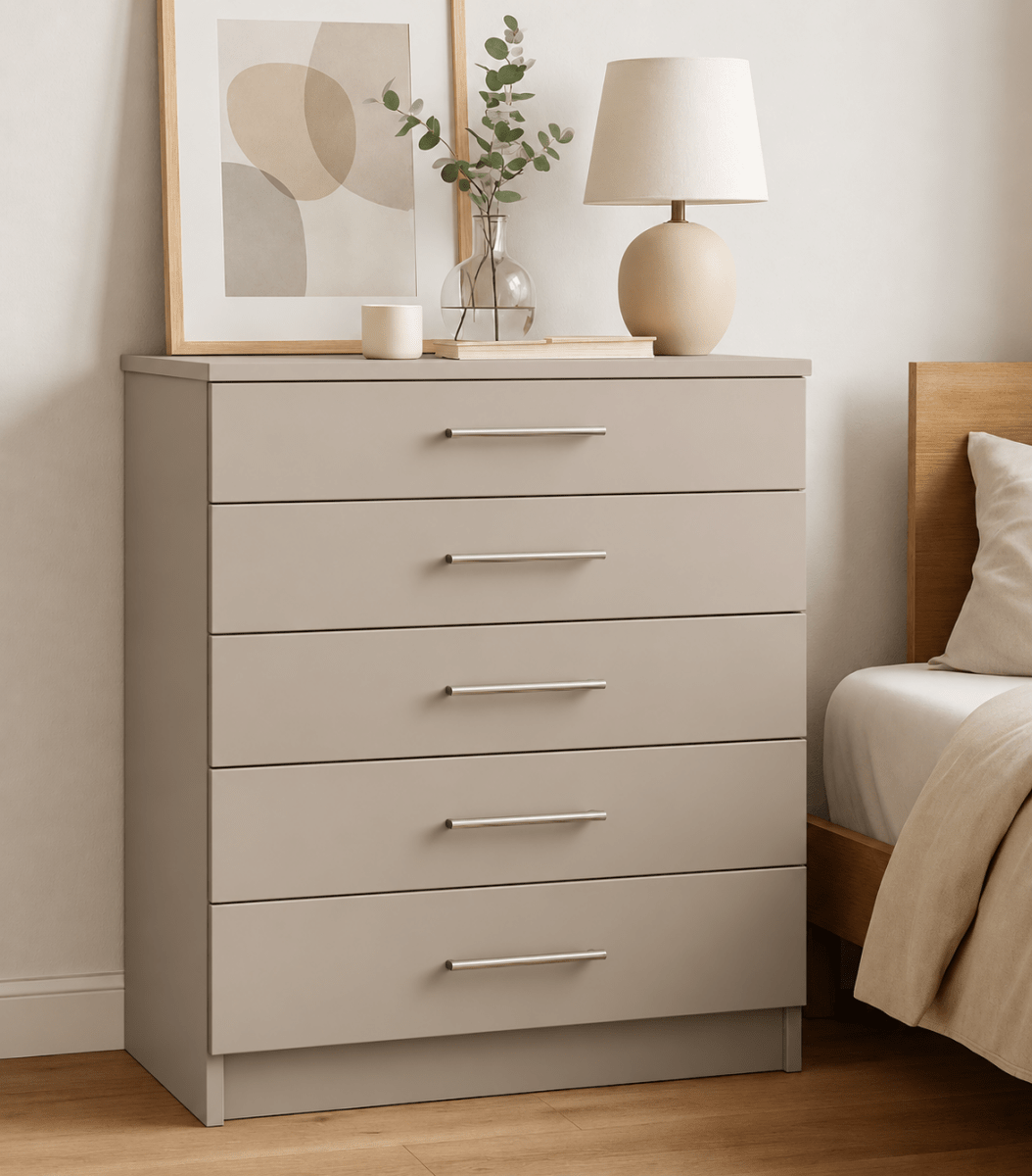Matt five-drawer chest styled with ceramics and a linen-shaded lamp