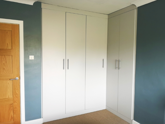 Cashmere fitted wardrobe in a small bedroom