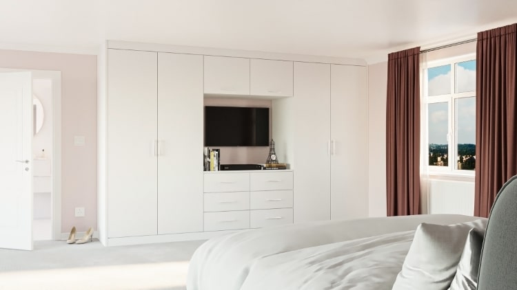 white fitted wardrobe with tv space